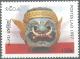Colnect-2785-504-Crown-with-ogre-mask.jpg