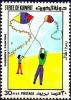 Colnect-5650-151-Boys-flying-kites.jpg