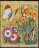 Colnect-2188-636-Strip-of-4-stamps-with-Flowers-and-Butterflies.jpg