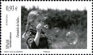 Colnect-2459-357-Girl-blowing-bubbles.jpg