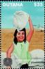 Colnect-4922-767-Girl-carrying-sack-on-her-head.jpg