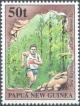 Colnect-3130-486-Competitor-running-through-Loniu-Caves.jpg