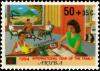 Colnect-3750-959-Family-seated-reading-studying.jpg