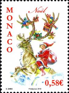 Colnect-1153-651-Girl-as-Santa-Claus-on-reindeer-with-adorned-antlers.jpg