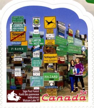 Colnect-766-428-Sign-Post-Forest-Watson-Lake-YT.jpg