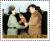 Colnect-2412-456-Kim-Jong-Il-receiving-bouquet-from-female-soldier.jpg
