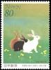 Colnect-1914-168-Rabbits-Playing-in-the-Field-in-Spring.jpg