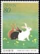 Colnect-1914-168-Rabbits-Playing-in-the-Field-in-Spring.jpg