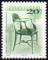 Colnect-496-534-Chair-by-K-aacute-roly-Lingel-1915.jpg