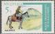 Colnect-1443-764-Horse-Equus-ferus-caballus-with-Rider.jpg