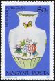 Colnect-4841-476-Vase-with-flowers-and-butterflies.jpg