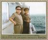 Colnect-3268-617-Kim-Jong-Il-with-naval-officers.jpg