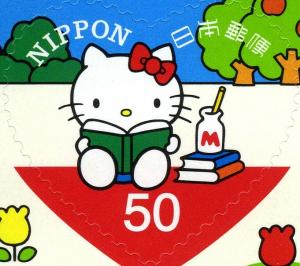 Colnect-3048-751-HELLO-KITTY-reading-a-book.jpg
