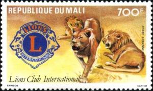 Colnect-2514-803-Lion-Panthera-leo-and-Emblem-of-Lions-Club.jpg