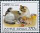 Colnect-3266-375-Cat-with-three-kittens.jpg