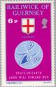 Colnect-125-654-Globe--amp--Guernsey-Flag.jpg