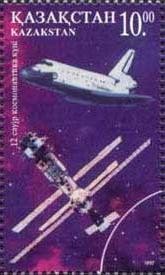 Colnect-1108-765-Space-shuttle-and--quot-Mir-quot--space-station.jpg