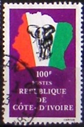 Colnect-552-407-Elephant-in-front-of-map-of-Ivory-Coast.jpg