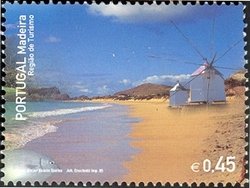 Colnect-546-309-Windmill-on-beach.jpg