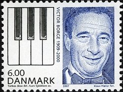 Colnect-418-541-Victor-Borge-entertainer-and-piano-keys.jpg