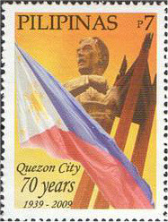 Colnect-2855-497-President-Manuel-L-Quezon--amp--Philippine-Flag.jpg