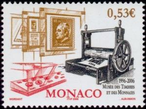 Colnect-1099-608-Showcases-with-coins-and-stamp-designs-old-printing-press.jpg