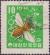 Colnect-2336-092-European-Honey-Bee-Apis-mellifera-Honeycomb-and-Clover.jpg