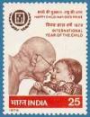 Colnect-1237-557-Gandhi-with-young-boy.jpg