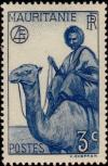 Colnect-803-006-Man-on-Dromedary-Camelus-dromedarius.jpg