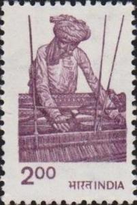 Colnect-3085-249-Worker-at-the-hand-loom.jpg