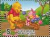 Colnect-4706-943-Winnie-the-Pooh-pushing-King-Penguins-Piglet-in-wheelbarrow.jpg