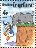 Colnect-7482-630-Donald-dangling-over-the-cliff-edge-from-the-horn-of-a-Rhino.jpg