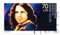 Jim_Morrison_Briefmarke_Deutsche_Bundespost_1988_Schuschke.png