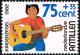 Colnect-2206-526-Child-playing-guitar.jpg