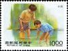 Colnect-4856-529-Boys-playing-in-water-with-bucket.jpg