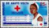 Colnect-507-603-Nurse-in-front-of-hospital.jpg