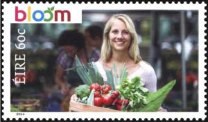 Colnect-2461-469-Lady-holding-fresh-vegetables.jpg