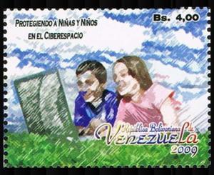 Colnect-5084-869-Man-and-woman-in-field-with-computer.jpg