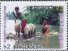 Colnect-5743-367-People-and-goats-in-flood-water.jpg