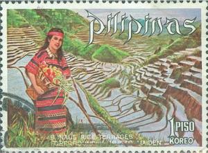 Colnect-2908-901-Ifugao-woman-and-banaue-rice-terraces.jpg