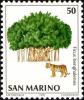 Colnect-1394-542-Tiger-Panthera-tigris-Banyan-Tree-Ficus-benghalensis.jpg