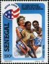 Colnect-2089-714-Peace-Corps-Worker-with-Children.jpg
