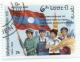 Colnect-1073-144-Four-persons-with-flag.jpg