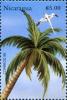 Colnect-5661-932-Palm-Tree-and-White-tailed-Tropicbird-Phaethon-lepturus.jpg
