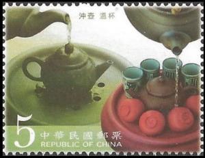 Colnect-3536-831-Wetting-the-tea-pot-and-the-cups.jpg