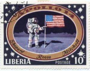 Colnect-1210-778-Astronauts-with-US-flag-on-moon.jpg