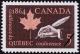 Colnect-683-307-Maple-Leaf-and-Hand-with-Quill-Pen.jpg