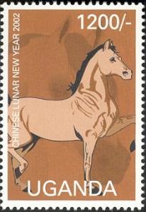 Colnect-2004-932-Tan-and-brown-horse-facing-right-with-two-feet-raised.jpg