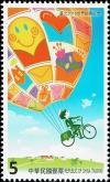 Colnect-3911-291-Postman-deliver-mail-hoisted-aloft-by-a-hot-air-balloon.jpg