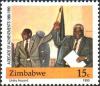 Colnect-3265-944-Mugabe--amp--Nkomo-Signing-Unity-Accord.jpg